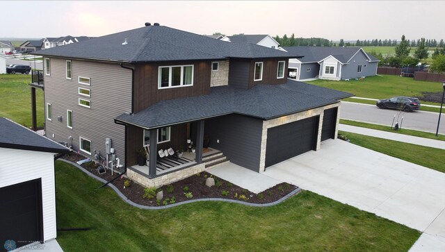 view of front of house featuring a garage and a front yard