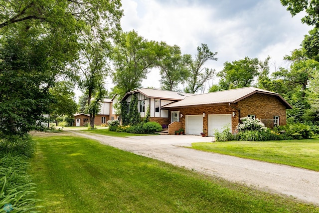 view of front of house featuring a garage and a front yard