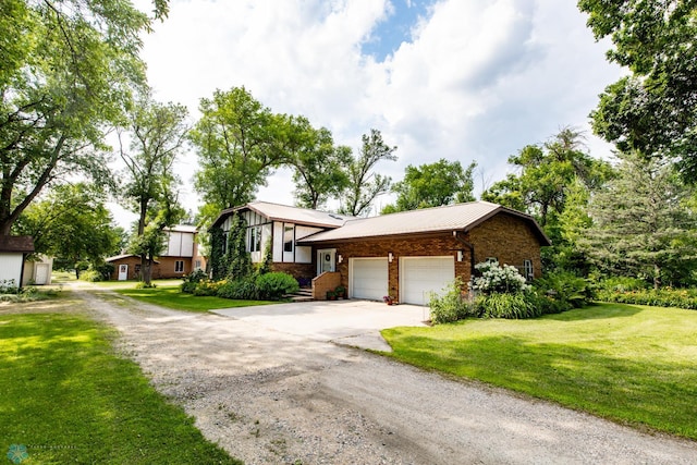 view of front facade with a garage and a front lawn