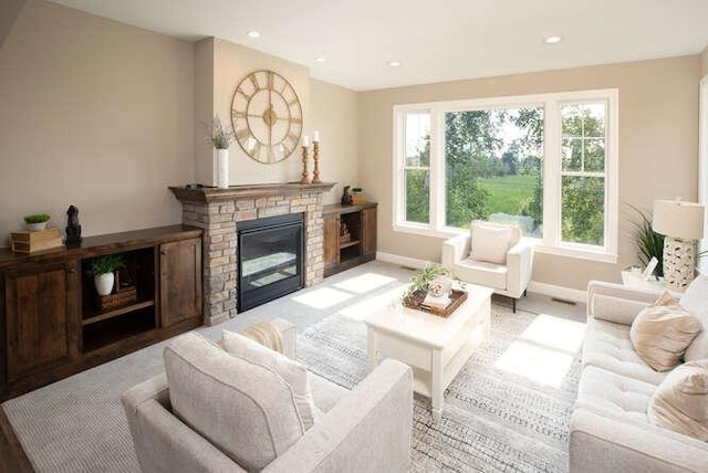 living room with a stone fireplace