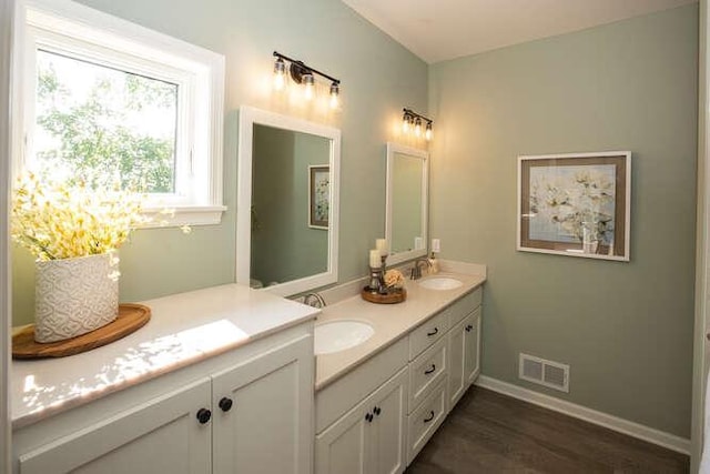 bathroom featuring vanity and hardwood / wood-style flooring