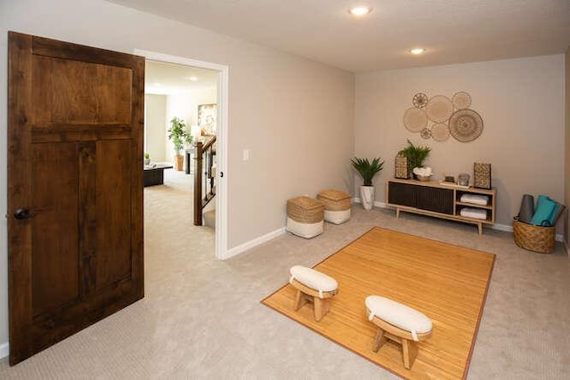 sitting room with light colored carpet