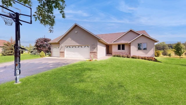 single story home with a garage, driveway, and a front yard