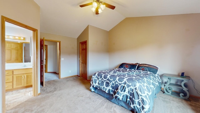 carpeted bedroom featuring ceiling fan, lofted ceiling, and connected bathroom