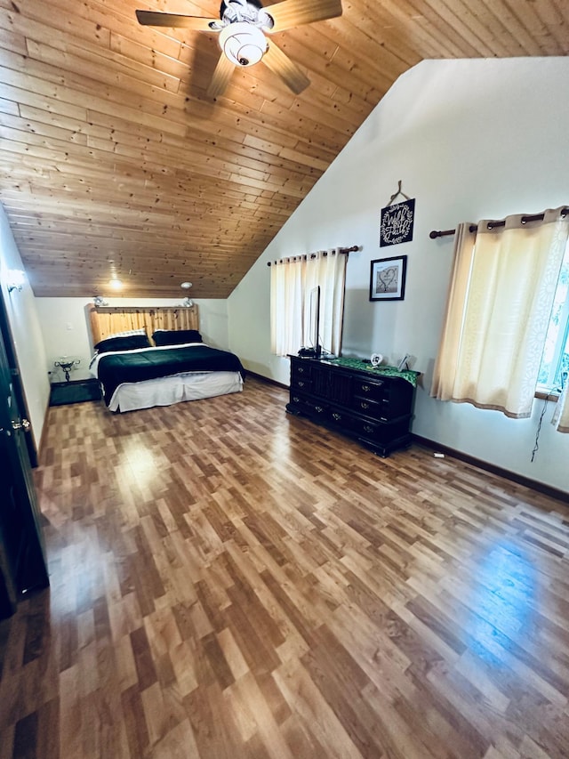 unfurnished bedroom featuring hardwood / wood-style floors, vaulted ceiling, wooden ceiling, and ceiling fan