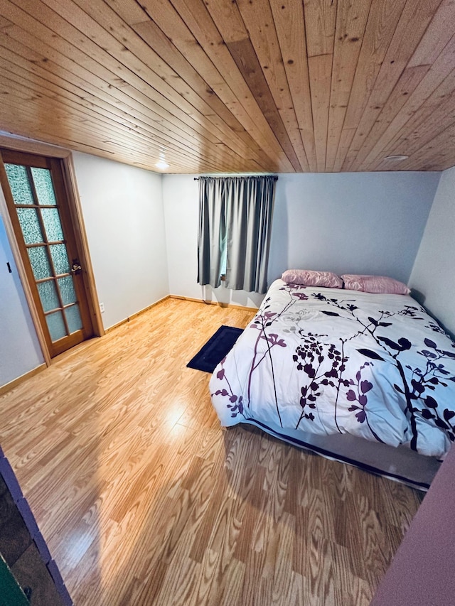 unfurnished bedroom with hardwood / wood-style flooring and wood ceiling