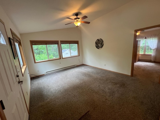 spare room with a baseboard heating unit, vaulted ceiling, ceiling fan, and carpet flooring