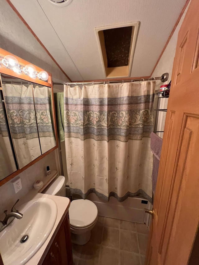 full bathroom featuring shower / bath combo, a textured ceiling, vanity, and toilet