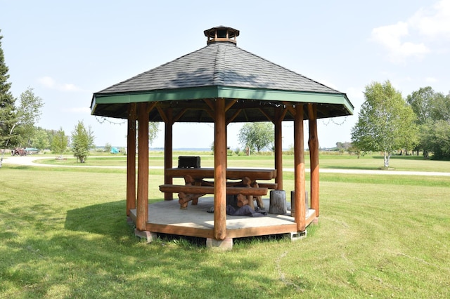 view of property's community with a gazebo and a yard