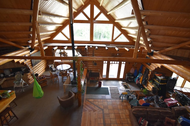 living area with wood ceiling and high vaulted ceiling