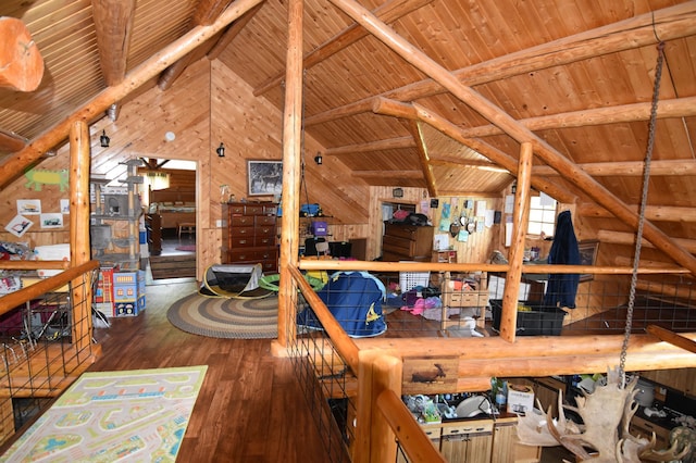 interior space with lofted ceiling with beams, wooden walls, wooden ceiling, and hardwood / wood-style flooring