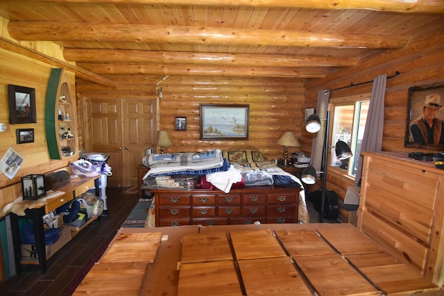 bedroom featuring wood ceiling, log walls, beamed ceiling, and dark hardwood / wood-style floors