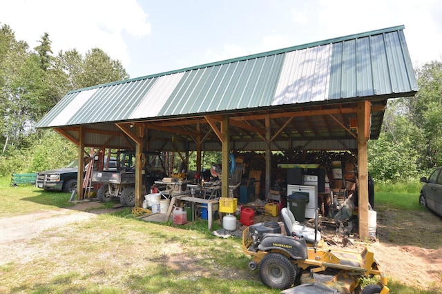 exterior space with a carport and an outbuilding