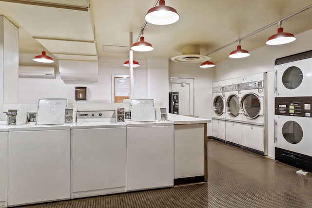 clothes washing area featuring washing machine and clothes dryer