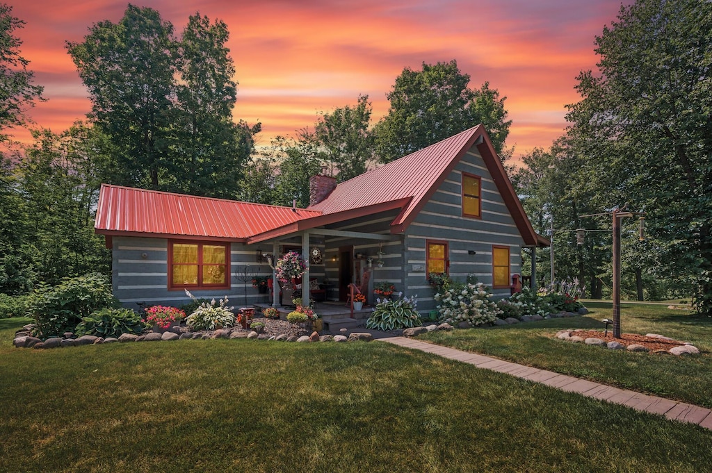 log cabin with a yard