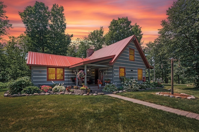 log cabin with a yard