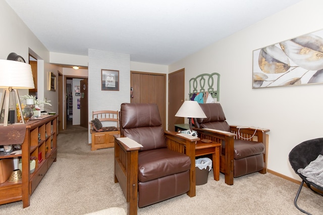 living area with light carpet