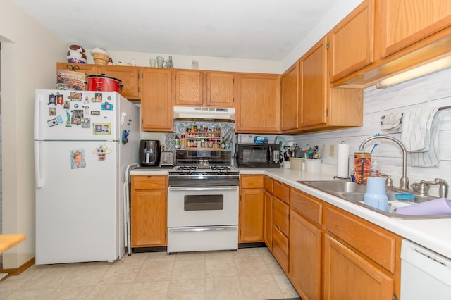 kitchen with white appliances, sink, and decorative backsplash