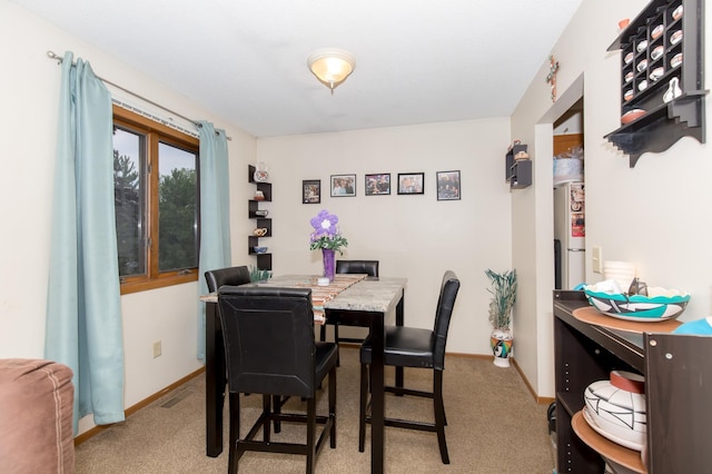 view of carpeted dining area