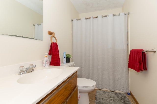 bathroom featuring tile patterned floors, toilet, a textured ceiling, vanity, and curtained shower