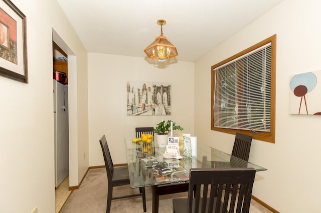 view of carpeted dining area