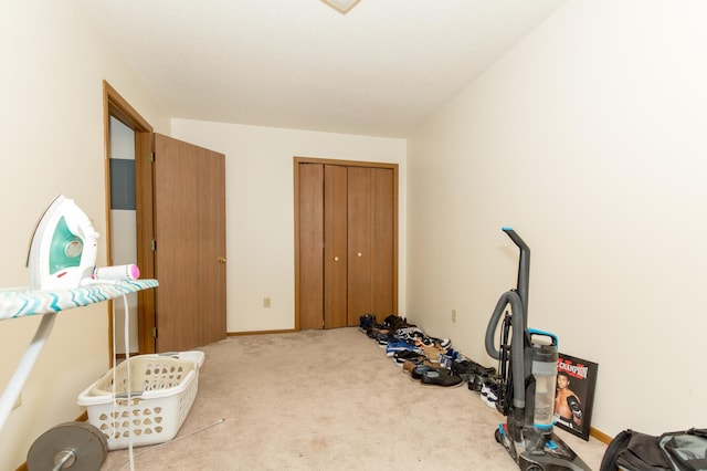 workout room with light colored carpet