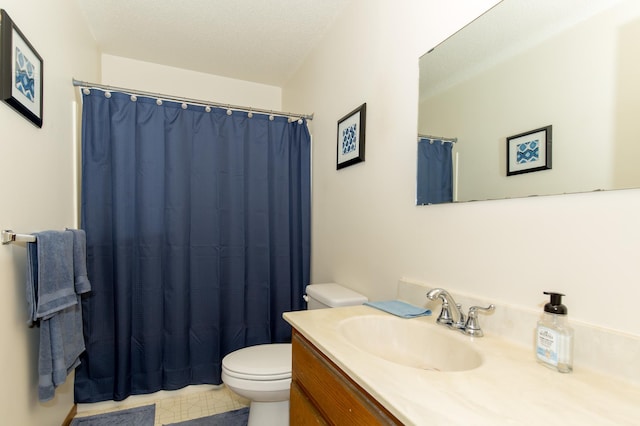 bathroom featuring vanity, toilet, curtained shower, and a textured ceiling