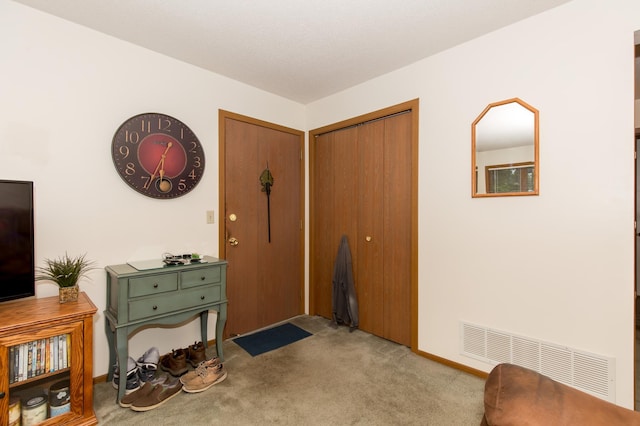 view of carpeted entryway