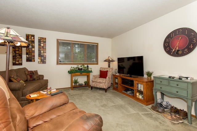 carpeted living room featuring a textured ceiling