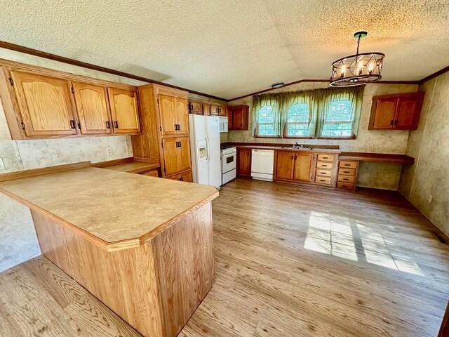 kitchen with white appliances, a chandelier, light wood-type flooring, vaulted ceiling, and decorative light fixtures