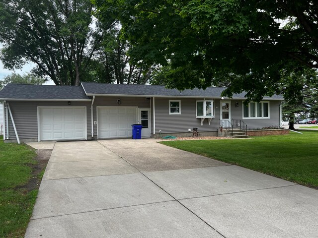 618 Memorial Pl, Dawson, MN 56232 - ranch-style house with a garage, a front yard, and driveway