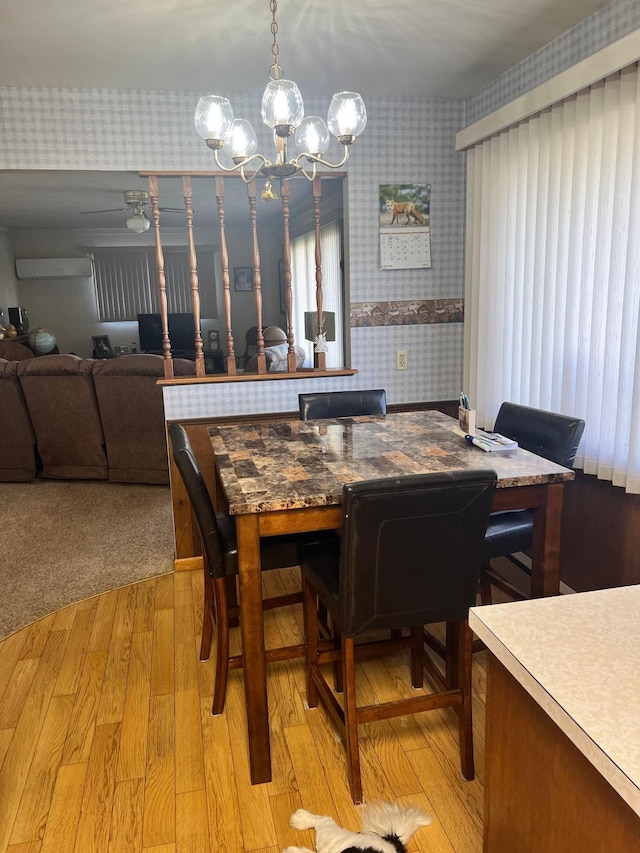 618 Memorial Pl, Dawson, MN 56232 - dining room with wallpapered walls, a chandelier, and light wood-style flooring