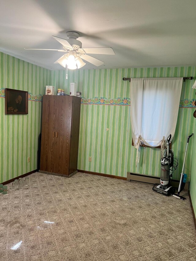 618 Memorial Pl, Dawson, MN 56232 - carpeted empty room featuring wallpapered walls and a ceiling fan