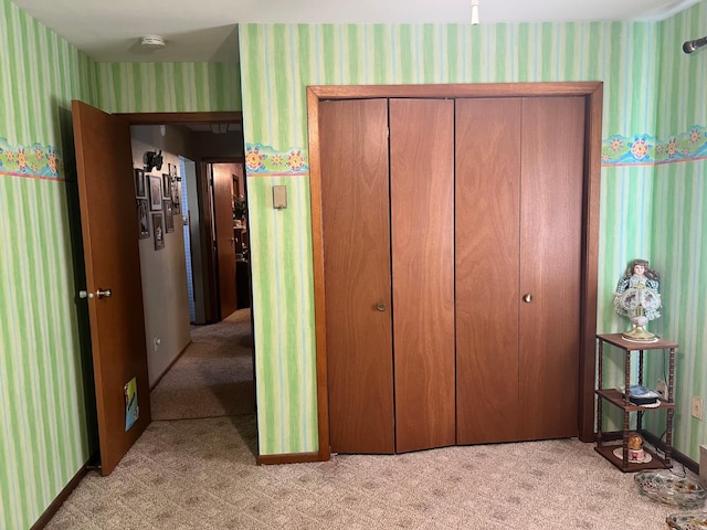 618 Memorial Pl, Dawson, MN 56232 - bedroom featuring wallpapered walls, light colored carpet, a closet, and baseboards