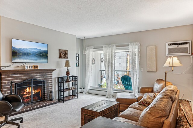 living room with a textured ceiling, an AC wall unit, carpet flooring, and a fireplace