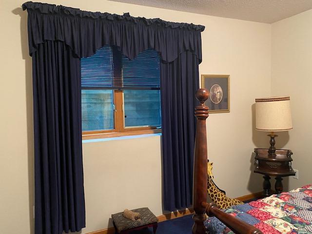 bedroom featuring a textured ceiling