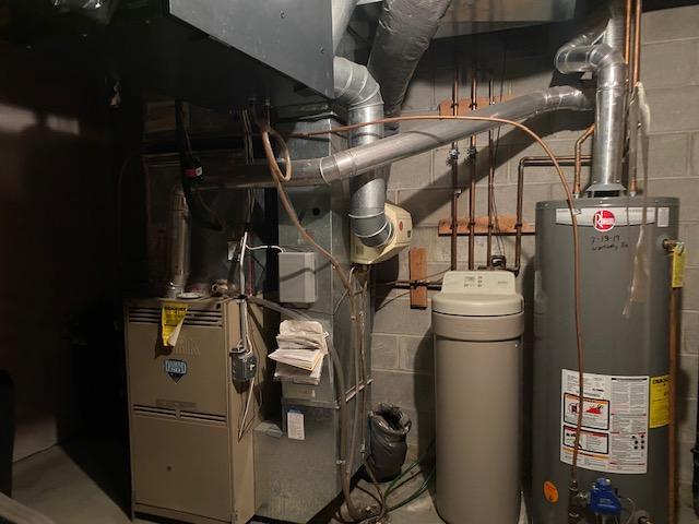 utility room with water heater