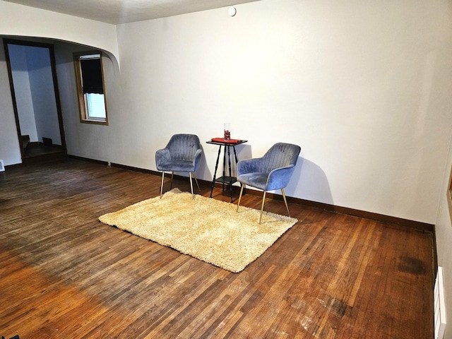 living area with dark wood-type flooring