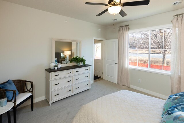 bedroom with light carpet and ceiling fan