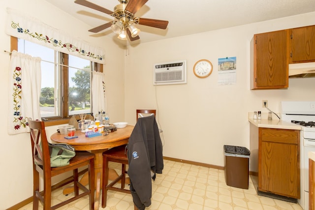 1600 Roundhouse Cir, Shakopee, MN 55379 - dining area featuring baseboards, a ceiling fan, light floors, and a wall unit AC