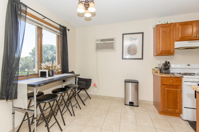 1600 Roundhouse Cir, Shakopee, MN 55379 - dining area with baseboards, a notable chandelier, and a wall mounted air conditioner