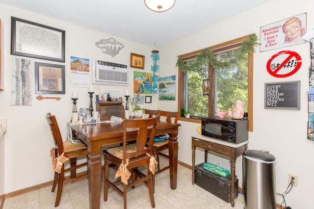 1600 Roundhouse Cir, Shakopee, MN 55379 - dining area featuring an AC wall unit and baseboards