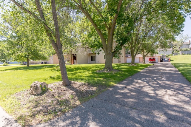 1600 Roundhouse Cir, Shakopee, MN 55379 - view of property hidden behind natural elements featuring a front lawn