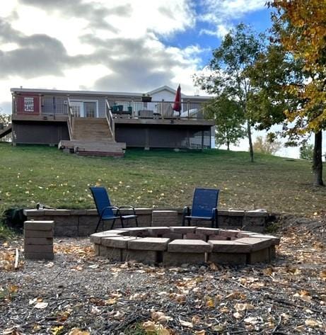 view of yard with a fire pit and a wooden deck