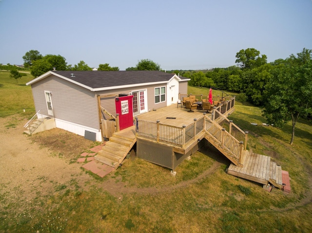 back of house featuring a wooden deck and outdoor lounge area