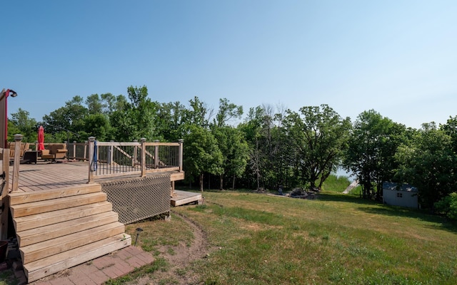 view of yard featuring a wooden deck