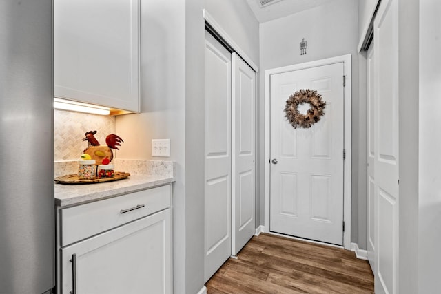 doorway to outside featuring hardwood / wood-style flooring