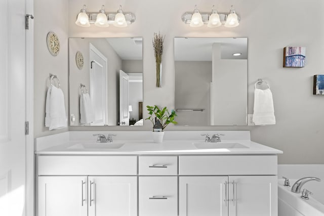 bathroom with a bathtub and vanity