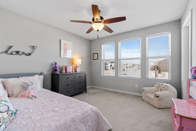 carpeted bedroom with ceiling fan and multiple windows