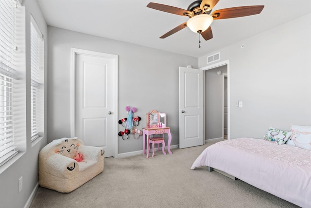 bedroom featuring ceiling fan and light colored carpet